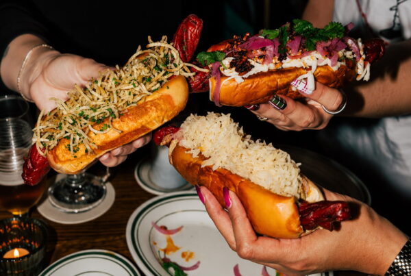 Gourmet sausages served in toasted bread with toppings