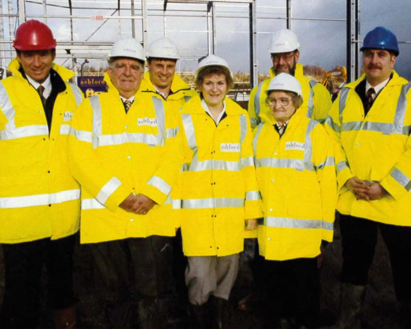 Factory workers wearing high-visibility clothing