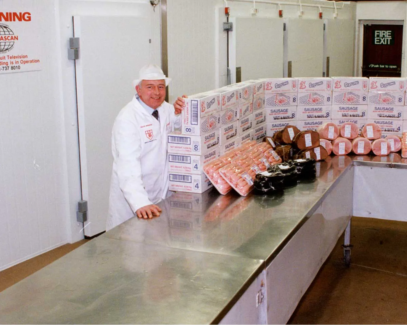 Food production staff posing inside a factory