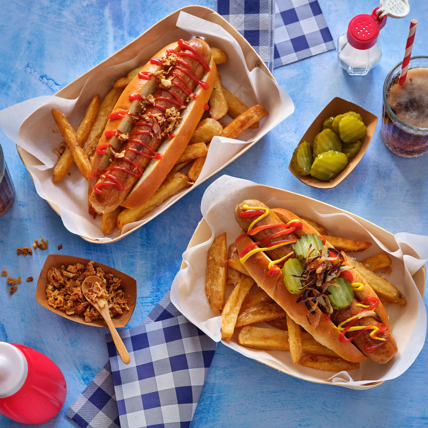 Hot dogs topped with sauces and garnishes